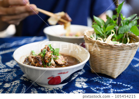 Rice noodles soup with pork and vegetables, Thai boat noodles style 105454215