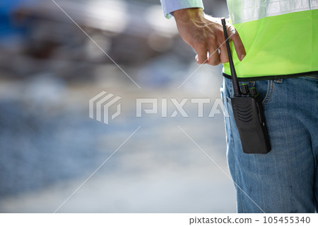 Close up walkie talkie. Man engineer with communication equipment walkie talkie. Close up walkie talkie. Man engineer with communication equipment walkie talkie. 105455340