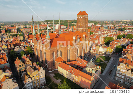 St. Mary's Basilica Beautiful panoramic architecture of old town in Gdansk, Poland at sunrise. Aerial view drone pov. Landscape cityscape City from Above. Small vintage historical buildings Europe St. Mary's Basilica Beautiful panoramic architecture of old town in Gdansk, Poland at sunrise. Aerial view drone pov. Landscape cityscape City from Above. Small vintage historical buildings Europe 105455415
