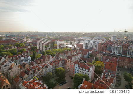 Beautiful panoramic architecture of old town in Gdansk, Poland at sunrise. Aerial view drone pov. Landscape cityscape City from Above. Small vintage historical buildings Europe Tourist Attractions Beautiful panoramic architecture of old town in Gdansk, Poland at sunrise. Aerial view drone pov. Landscape cityscape City from Above. Small vintage historical buildings Europe Tourist Attractions 105455425
