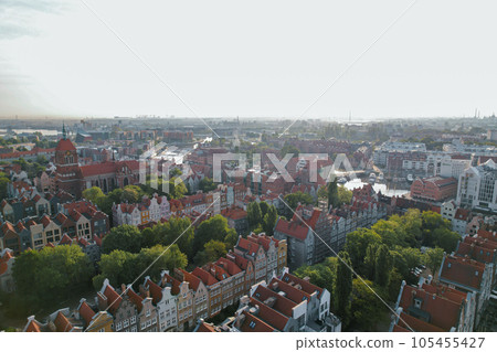 Beautiful panoramic architecture of old town in Gdansk, Poland at sunrise. Aerial view drone pov. Landscape cityscape City from Above. Small vintage historical buildings Europe Tourist Attractions Beautiful panoramic architecture of old town in Gdansk, Poland at sunrise. Aerial view drone pov. Landscape cityscape City from Above. Small vintage historical buildings Europe Tourist Attractions 105455427