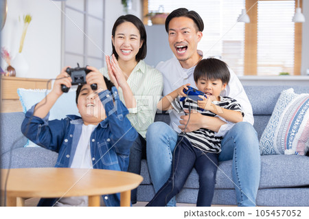 Family portrait Family enjoying video games Family portrait Family enjoying video games 105457052