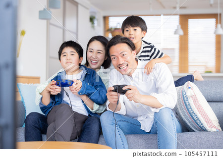 Family portrait Family enjoying video games Family portrait Family enjoying video games 105457111