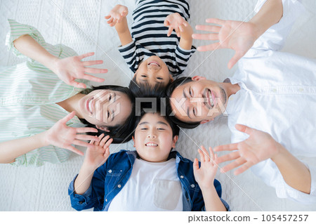 Family portrait A family lying down with a smile 105457257
