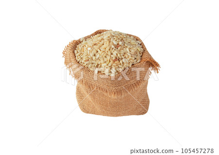 Brown rice grain in the sack isolated on white. Brown rice grain in the sack isolated on white. 105457278