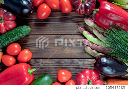 Vegetables on the dark textured wooden planks. Vegetables on the dark textured wooden planks. 105457285