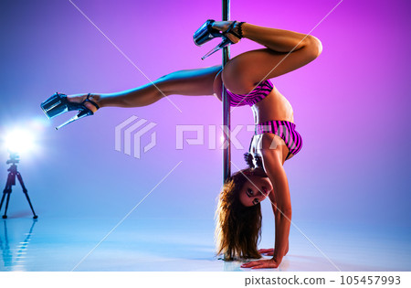Woman poledancing Woman poledancing 105457993