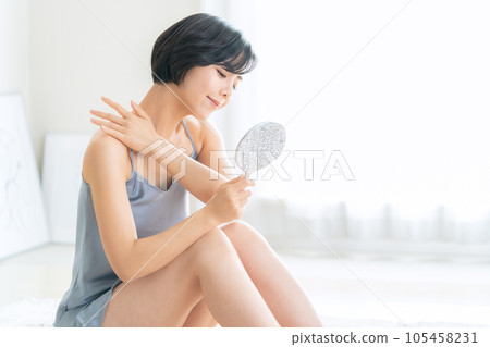 A young woman doing skin care A young woman doing skin care 105458231