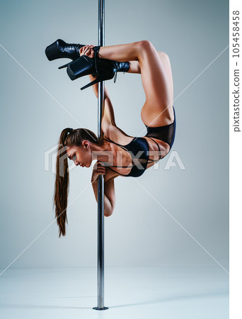 Woman pole dancing 105458458