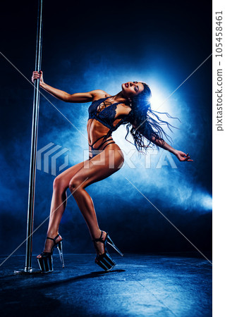 Young woman pole dancing 105458461