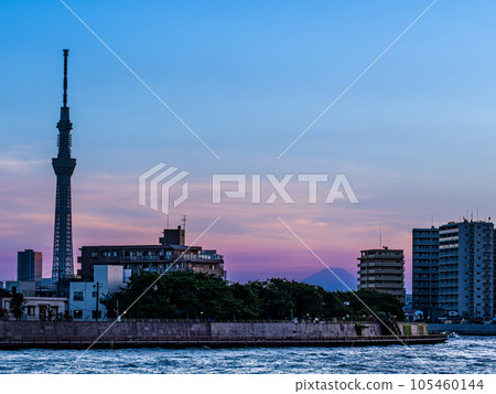 Nakagawa River flowing through Katsushika, Tokyo in July, Sky Tree and Mt. Fuji evening view 105460144