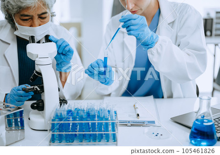 Scientist team meeting and writing analysis results in the laboratory study and analyze scientific sample for global warming, analytics and tech.. Scientist team meeting and writing analysis results in the laboratory study and analyze scientific sample for global warming, analytics and tech.. 105461826