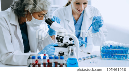 Scientist team meeting and writing analysis results in the laboratory study and analyze scientific sample for global warming, analytics and tech.. Scientist team meeting and writing analysis results in the laboratory study and analyze scientific sample for global warming, analytics and tech.. 105461938