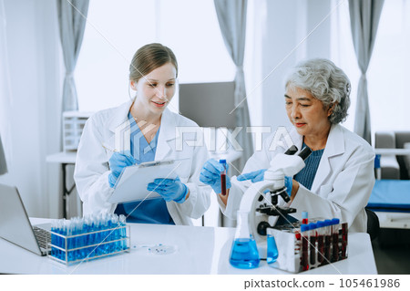 Scientist team meeting and writing analysis results in the laboratory study and analyze scientific sample for global warming, analytics and tech.. 105461986