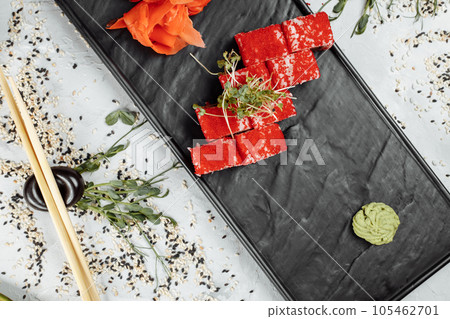 Traditional delicious fresh sushi roll set. Sushi roll with rice, nori, cream cheese, tobiko caviar, avocado. Sushi menu. Traditional delicious fresh sushi roll set. Sushi roll with rice, nori, cream cheese, tobiko caviar, avocado. Sushi menu. 105462701