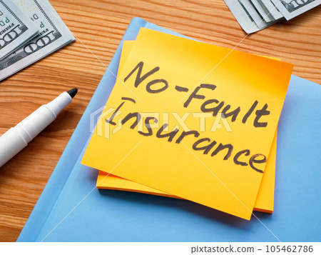 A Sticker with memo No fault insurance and notepad. 105462786