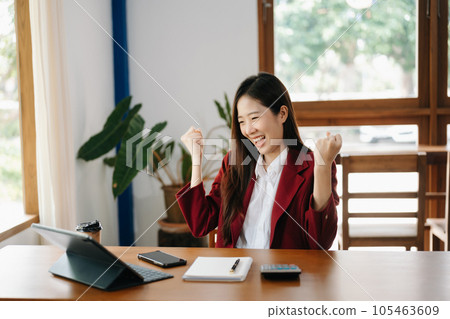 Asian business woman are delighted and happy with the work they do on their tablet, laptop and taking notes at the office.. Asian business woman are delighted and happy with the work they do on their tablet, laptop and taking notes at the office.. 105463609