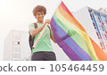 Smiling handsome young man with LGBT flag in his hands 105464459