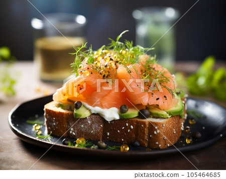 smoked salmon toast with egg and avocado. 105464685