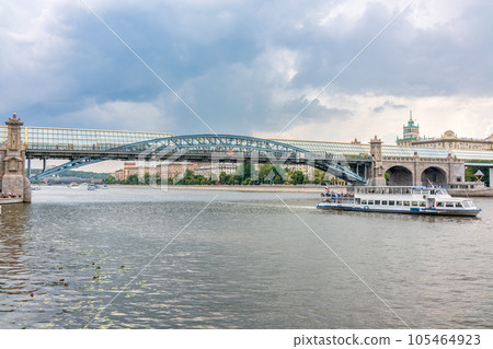 View of the Moscow river embakment, Pushkinsky bridge and cruise ships at sunset. 105464923