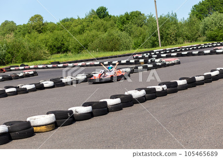 Youth Go Kart Racer on track. 105465689