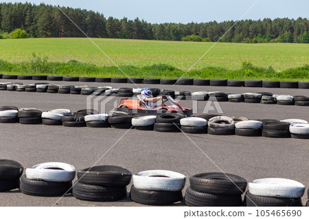 Youth Go Kart Racer on track. 105465690