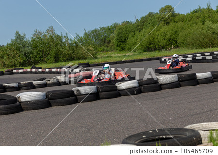 Youth Go Kart Racer on track. 105465709