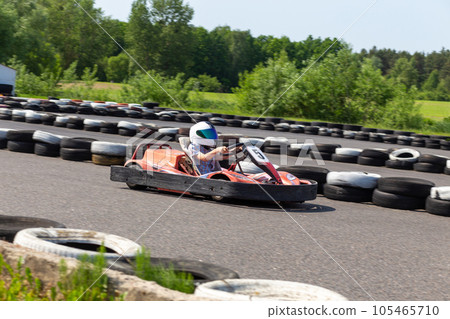 Youth Go Kart Racer on track. Youth Go Kart Racer on track. 105465710