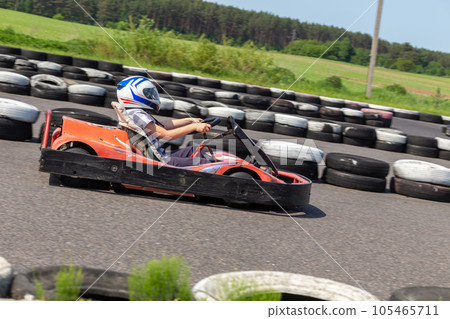 Youth Go Kart Racer on track. 105465711
