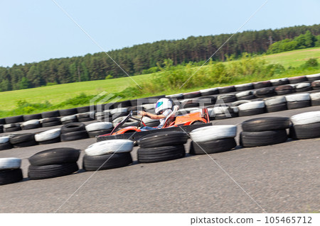 Youth Go Kart Racer on track. 105465712