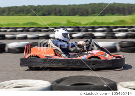 Youth Go Kart Racer on track. 105465714