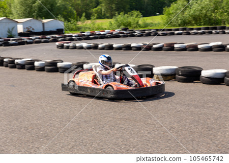 Youth Go Kart Racer on track. 105465742