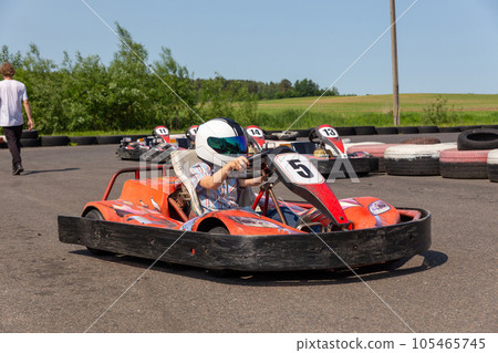Youth Go Kart Racer on track. 105465745