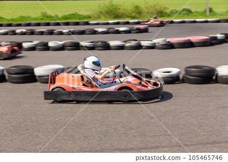 Youth Go Kart Racer on track. 105465746