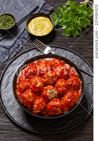 Iowa Ham Balls with tomato sauce in bowl 105466920