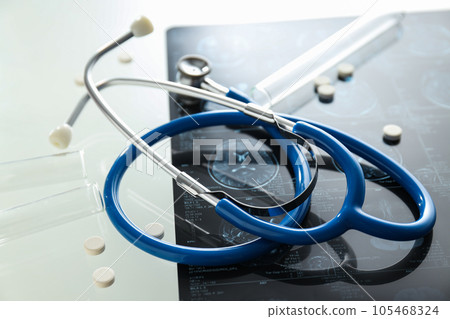 MRI or magnetic resonance imaging of head and brain with stethoscope and pills. MRI or magnetic resonance imaging of head and brain with stethoscope and pills. 105468324