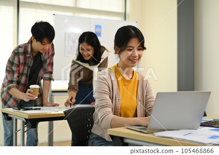 Group of application developers working on new website wireframe, planning application development at creative office Group of application developers working on new website wireframe, planning application development at creative office 105468866