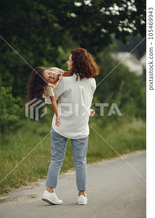 Family in a summer field. Sensual photo. Cute little girl. 105469943