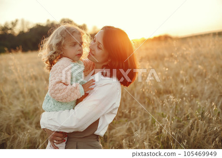 Family in a summer field. Sensual photo. Cute little girl. Family in a summer field. Sensual photo. Cute little girl. 105469949