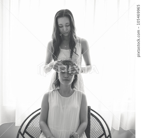 Two women in white dress 105469965