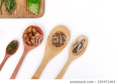 Top view of Herbal medicine preparation with fresh herbs and dried flowers, aromatherapy essential oil and mortar with pestle used in natural alternative remedies on white table. Top view of Herbal medicine preparation with fresh herbs and dried flowers, aromatherapy essential oil and mortar with pestle used in natural alternative remedies on white table. 105471463