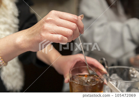 Snack mom making drinks at the counter Snack mom making drinks at the counter 105472069