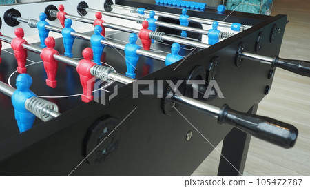 Football table or soccer table game with plastic player figurine. Mini Soccer game which famous in past and be collectable item for foosball lover. Play by two hand control each row of player figurine 105472787