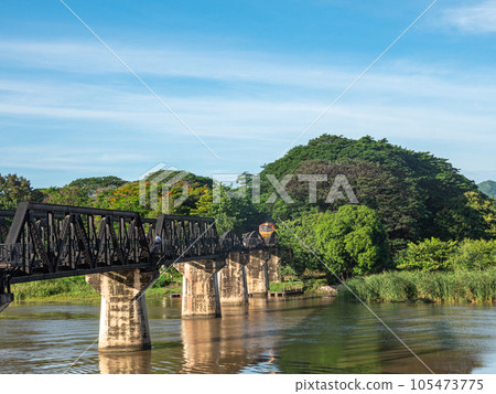 The train is passing through the Death Railway Bridge over the River Kwai in Kanchanaburi. During World War Two Japan constructed railway from Thailand to Burma This is now know the Death Railway. The train is passing through the Death Railway Bridge over the River Kwai in Kanchanaburi. During World War Two Japan constructed railway from Thailand to Burma This is now know the Death Railway. 105473775