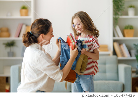 Happy family preparing for school 105474429