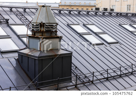 Metal roof with ventilation shafts and attic windows 105475762
