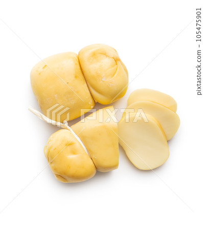 Smoked scamorza cheese isolated on white background. 105475901