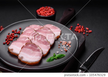Delicious smoked bacon with salt, spices and herbs 105476329