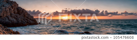 Sunset over the ocean 105476608