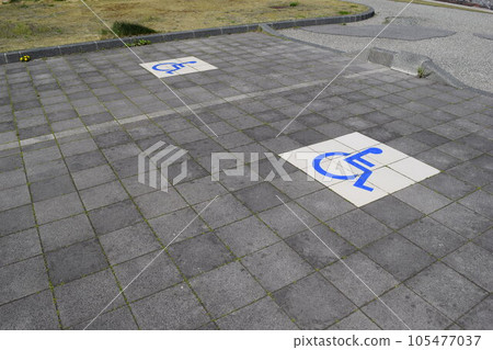 Wheelchair mark caring parking lot 105477037